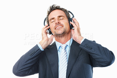 Buy stock photo Businessman, headphones and relaxing to music, streaming radio and audio or song, chill on break. Male person, connection and dance to album, podcast and sound at studio, peace and white background