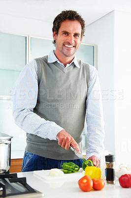 Buy stock photo Portrait, happy man and cutting vegetables for cooking healthy diet, food or nutrition in home kitchen. Smile, knife and chopping board for vegan, lunch and organic meal prep for salad ingredients