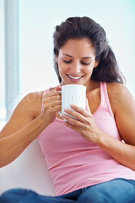 Buy stock photo Relax, coffee break and woman in house for thinking, resting or enjoying peaceful moment, day off or me time. Face, smile and female person in a living room with tea, calm or weekend freedom chilling