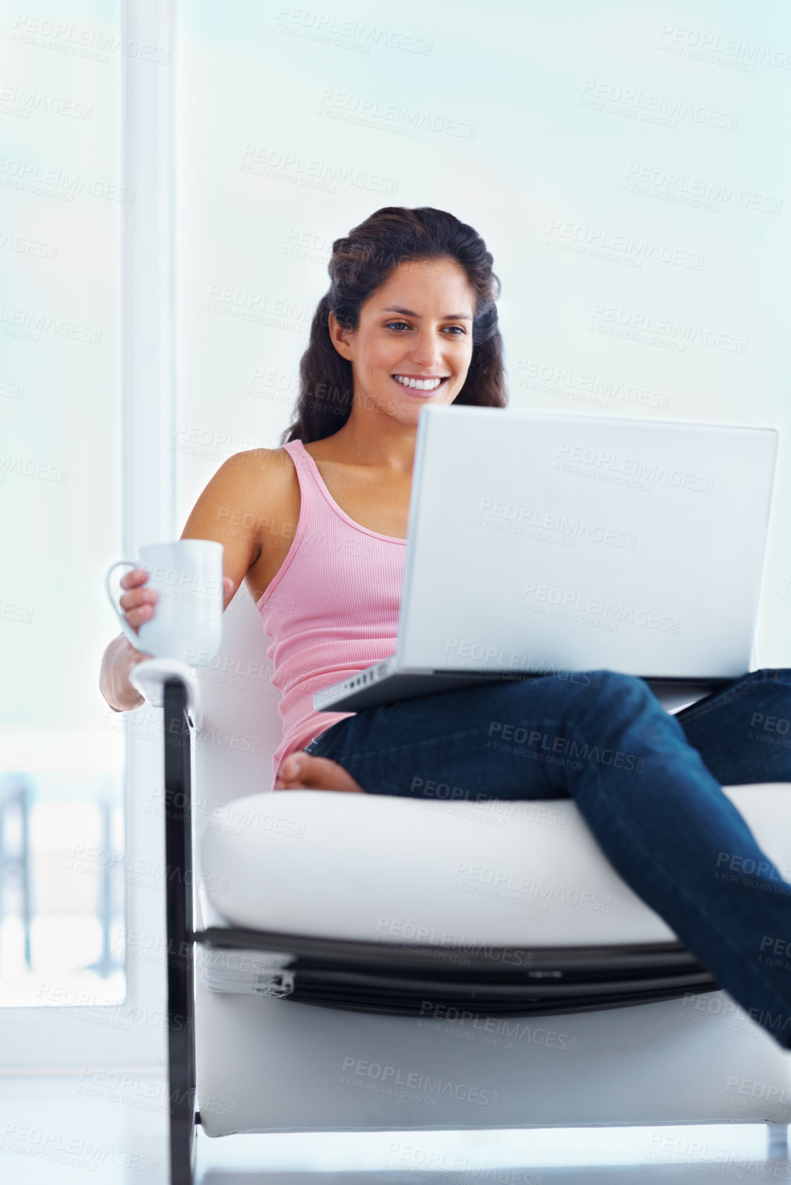 Buy stock photo Woman, happy and coffee with laptop with reading digital blog and relax wellness in chair in home. Young person, smile and computer with espresso for online subscription and technology in apartment