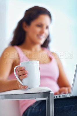 Buy stock photo Coffee, home and woman typing on laptop for remote working, freelance career and relax on break. Happy, morning and person on computer with warm beverage for internet, website research and blog