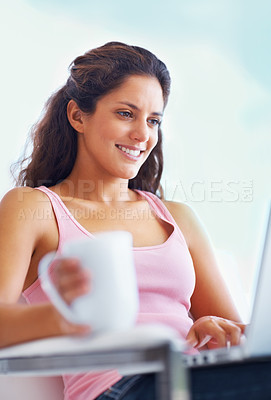 Buy stock photo Woman, smile and coffee with laptop with reading digital blog and relax wellness in chair in home. Young person, happy and computer with espresso for online subscription and technology in apartment