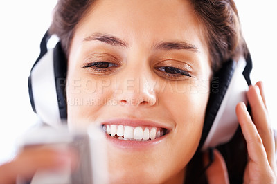 Buy stock photo Headphones, music player and woman face listening to playlist track, audio podcast or wellness sound. Closeup, tech and relax girl reading, scroll or choice for media, song or radio streaming app