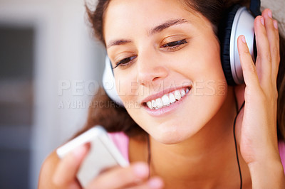 Buy stock photo Music, podcast and streaming with a woman listening to audio on the radio with headphones. Relax, freedom and beauty with a young, happy female giving a smile and holding a digital device for a track