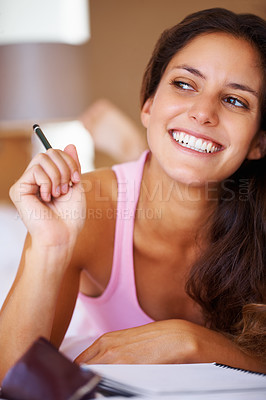 Buy stock photo Woman, happy and writing with notepad with creative ideas and planning article as journalist on bed. Young person, smile and pencil with book for work with wellness and brainstorming in apartment