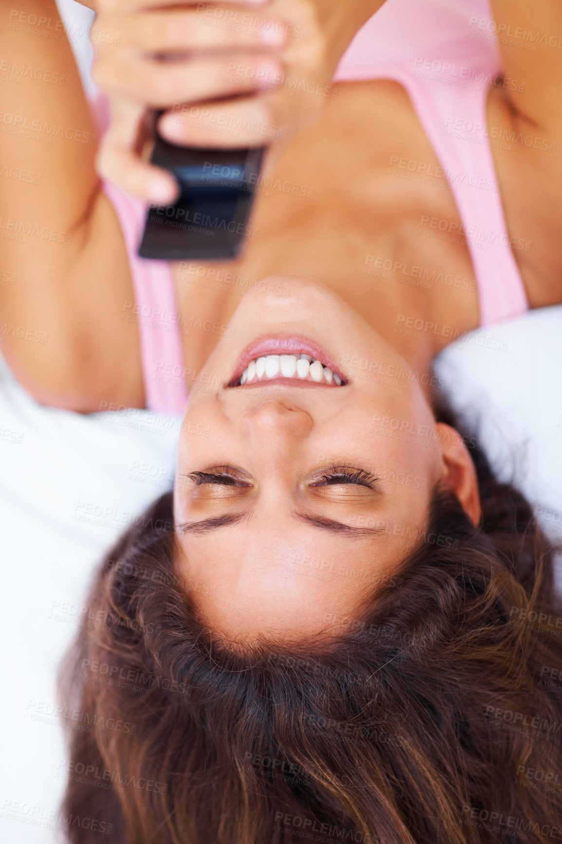 Buy stock photo Top view, smile and woman with phone on bed, social media and relax at home in the morning. Above, happy person on smartphone in bedroom and typing, scroll or communication on internet, mobile or app