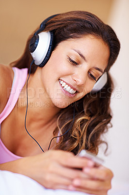 Buy stock photo Smile, headphones and young woman listening to music, playlist or radio at home for entertainment. Happy, technology and female person from Canada relax and streaming song or album in her apartment.