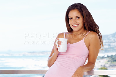 Buy stock photo Portrait, smile and woman drinking coffee at balcony in home, mockup or space. Face, tea cup and happy person at terrace with healthy beverage, espresso or latte by ocean to relax in the morning