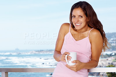 Buy stock photo Portrait, happy and woman drinking coffee at balcony in home, mockup or ocean view. Face, tea cup and happy person at terrace with beverage, espresso or latte for breakfast to relax in the morning