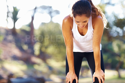 Buy stock photo Fitness, breathing and tired woman in a park for workout break, recovery or resting after cardio run. Sports, fatigue and female runner stop to breathe in a forest for wellness, training or exercise