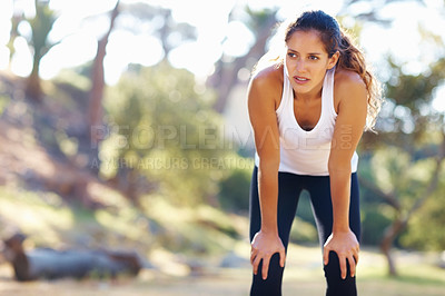 Buy stock photo Thinking, fitness and tired woman in a park for workout break, recovery or resting after cardio run. Sports, fatigue and female runner stop to breathe in a forest for wellness, training or exercise