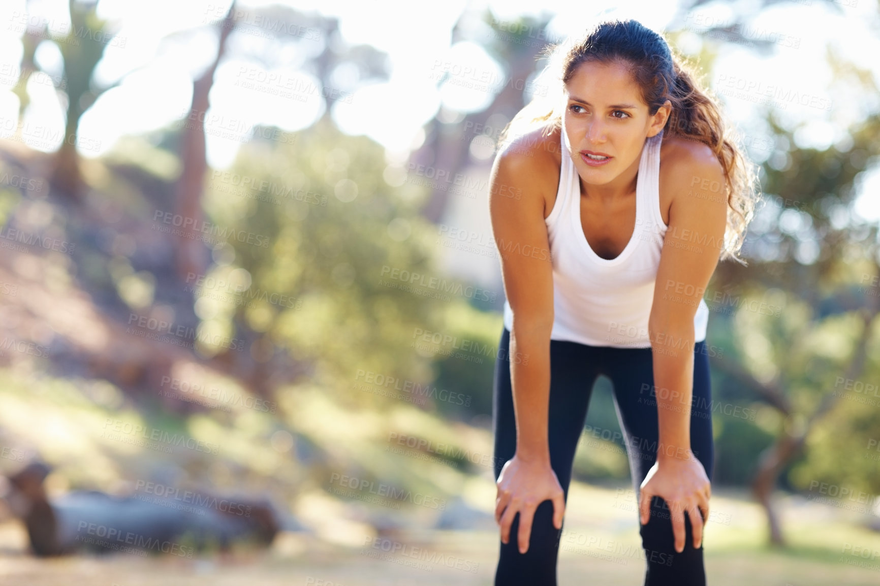 Buy stock photo Thinking, fitness and tired woman in a park for workout break, recovery or resting after cardio run. Sports, fatigue and female runner stop to breathe in a forest for wellness, training or exercise