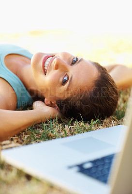 Buy stock photo Grass, laptop and face of girl, rest and student in park, relax and studying for exam with smile. Outdoor, portrait and woman on lawn, nature or happy with computer, finished and knowledge of project