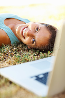 Buy stock photo Grass, laptop and portrait of girl, rest and student in park, relax and studying for exam with smile. Outdoor, person and woman in lawn, nature and happy with computer, online and internet for search