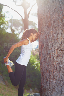 Buy stock photo Woman, feet and stretching by tree for fitness, workout or runner with training sport in nature or forest. Young athlete or tired person stop with legs, muscle or balance in woods for exercise