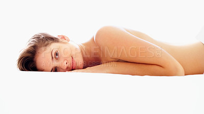 Buy stock photo Portrait of a cute young female lying topless against white background