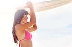 Beautiful young girl holding a surfboard