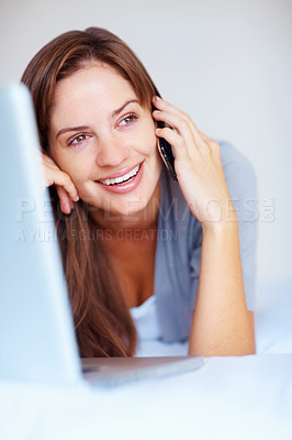 Buy stock photo Relax, phone call and woman on bed with laptop, smile and networking with conversation, connection and chat. Wake up, morning and happy girl with cellphone, computer and communication in bedroom.