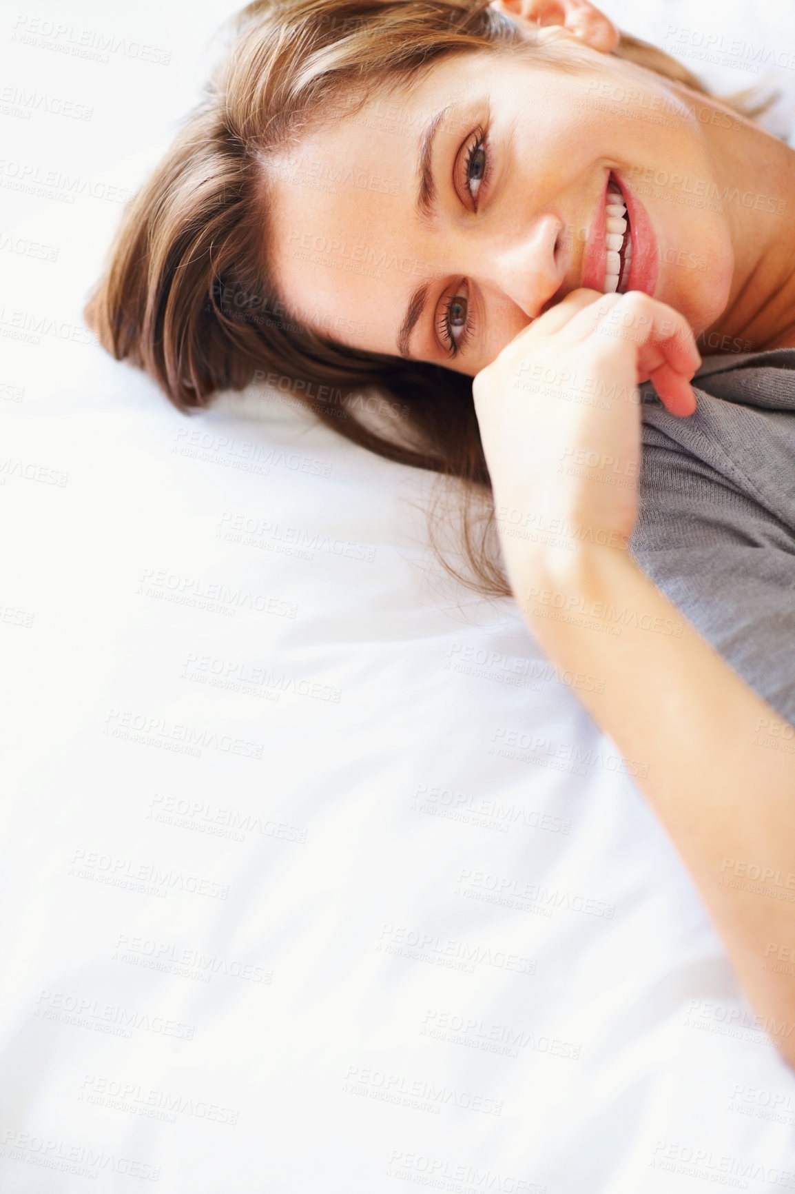 Buy stock photo Relax, blanket and portrait of happy woman on bed for sleeping, dreaming and comfortable. Smile, home and face of person in bedroom resting, nap and wake up for health, wellness and calm in morning