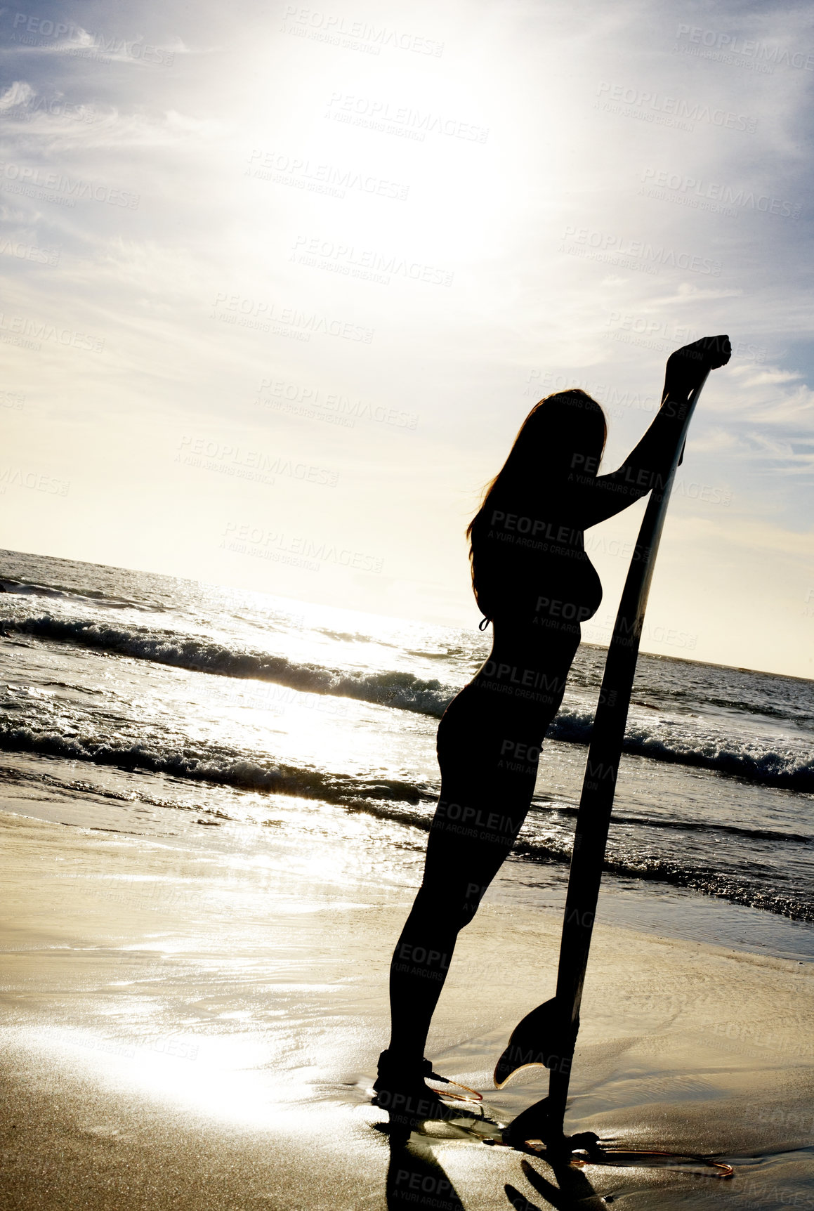 Buy stock photo Portrait of a young lady standing with surfboard on the sea shore