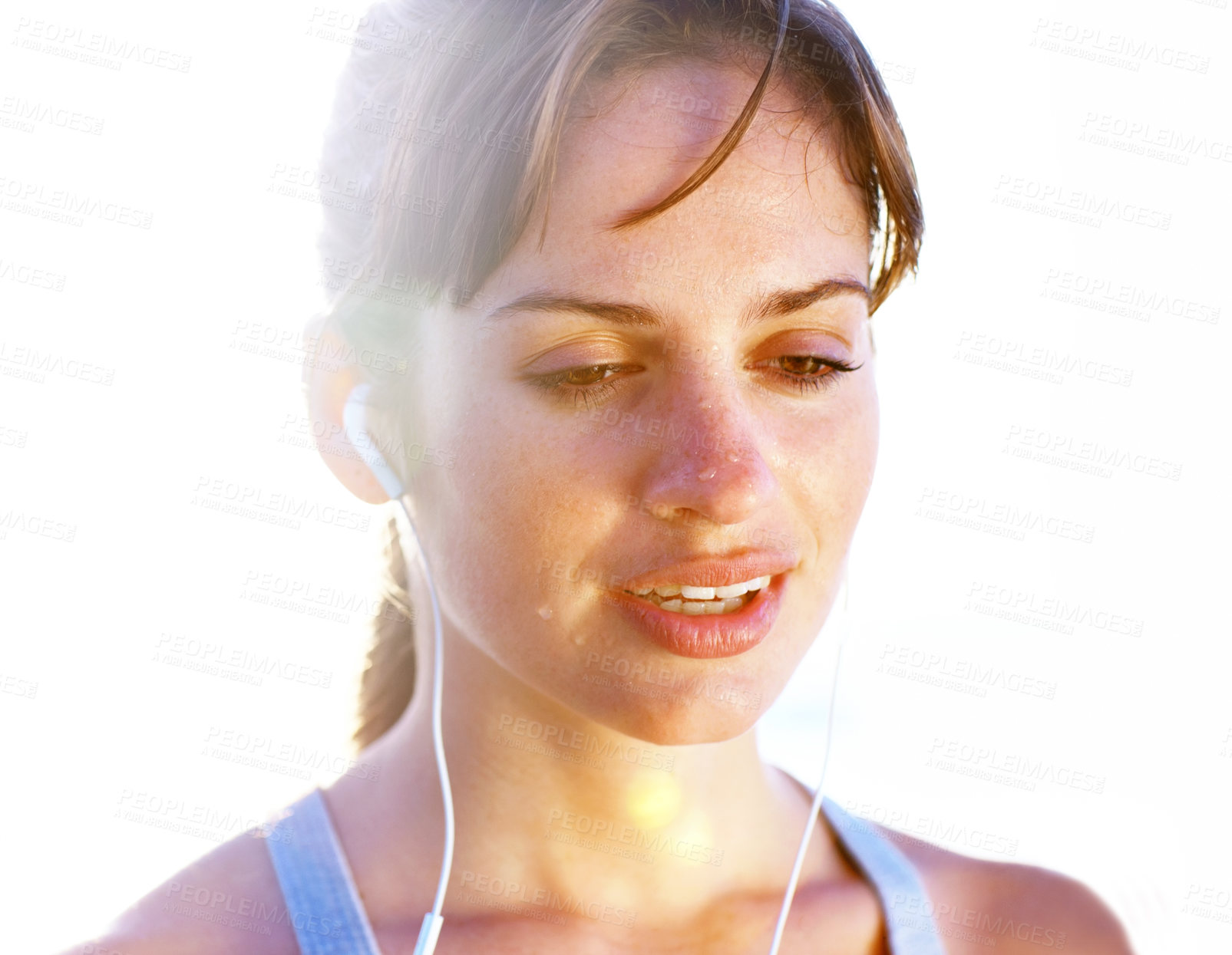 Buy stock photo Earphones, face and sweat of woman for exercise, cardio and training in summer with lens flare. Tired, break and breathing with music, podcast and fitness of intense workout for sports or marathon