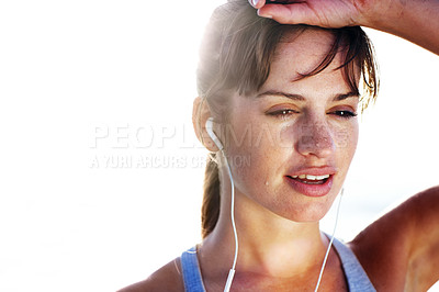 Buy stock photo Woman, athlete and tired with earphones outdoor for fitness, gym workout and streaming music, audio or mockup. Health, sweating and sports of runner on break, listening to radio or wellness of energy