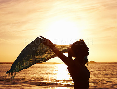 Buy stock photo Silhouette, freedom and woman on beach for vacation, holiday and adventure in Puerto Rico. Scenic view, sunset and girl with shawl for peace, relax and summer break in ocean for wellness and tranquil