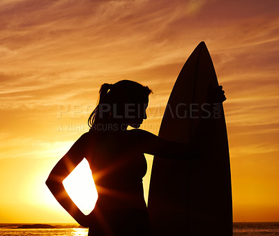 Buy stock photo Sunset, ocean and woman surfer with silhouette for fitness or outdoor training with professional. Tranquil, health and beautiful beach coast for cardio with happiness, lens flare and surfboard.