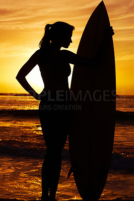 Buy stock photo Ocean, sunset and woman surfer with silhouette for fitness or outdoor training with professional. Waves, health and summer beach coast for cardio with happiness, lens flare and dark surfboard.