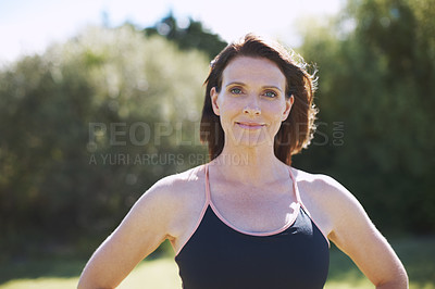 Buy stock photo Head and shoulder shot of an attractive woman in sports clothing standing in the outdoors