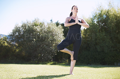 Buy stock photo Full-length shot of an attractive woman practicing yoga