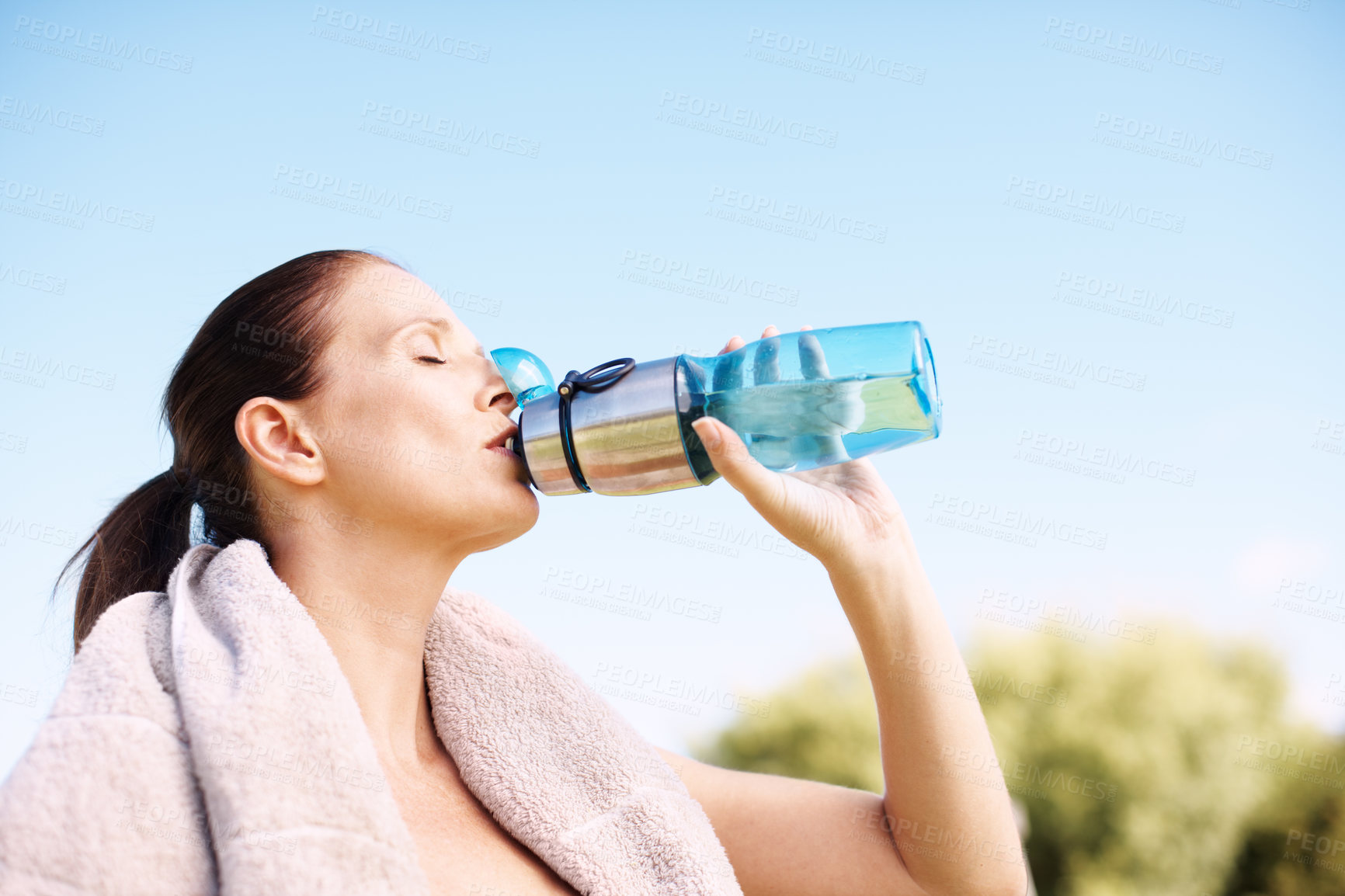 Buy stock photo Mature, woman and workout or drink water outside in nature, hydration and health or outdoor fitness goal. Sport, wellness athlete and training in summer for female person, runner and park or break