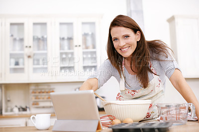 Buy stock photo Baker, woman and portrait with tablet in kitchen for ingredients, recipe or instruction on cake in home. Online, browsing internet and baking person with bowl for dessert, cookies or sweet cupcakes