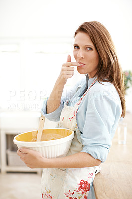 Buy stock photo Portrait, woman and baking by tasting batter in kitchen with ingredients, hungry or baker for dessert process. Smile, female chef and eating food, cooking cake or happiness at house
