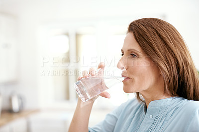 Buy stock photo Home, kitchen and woman with drinking water in glass for minerals, hydration and healthy diet. Female person, thirsty and thinking with aqua in house for liquid detox, wellness and h2o nutrition