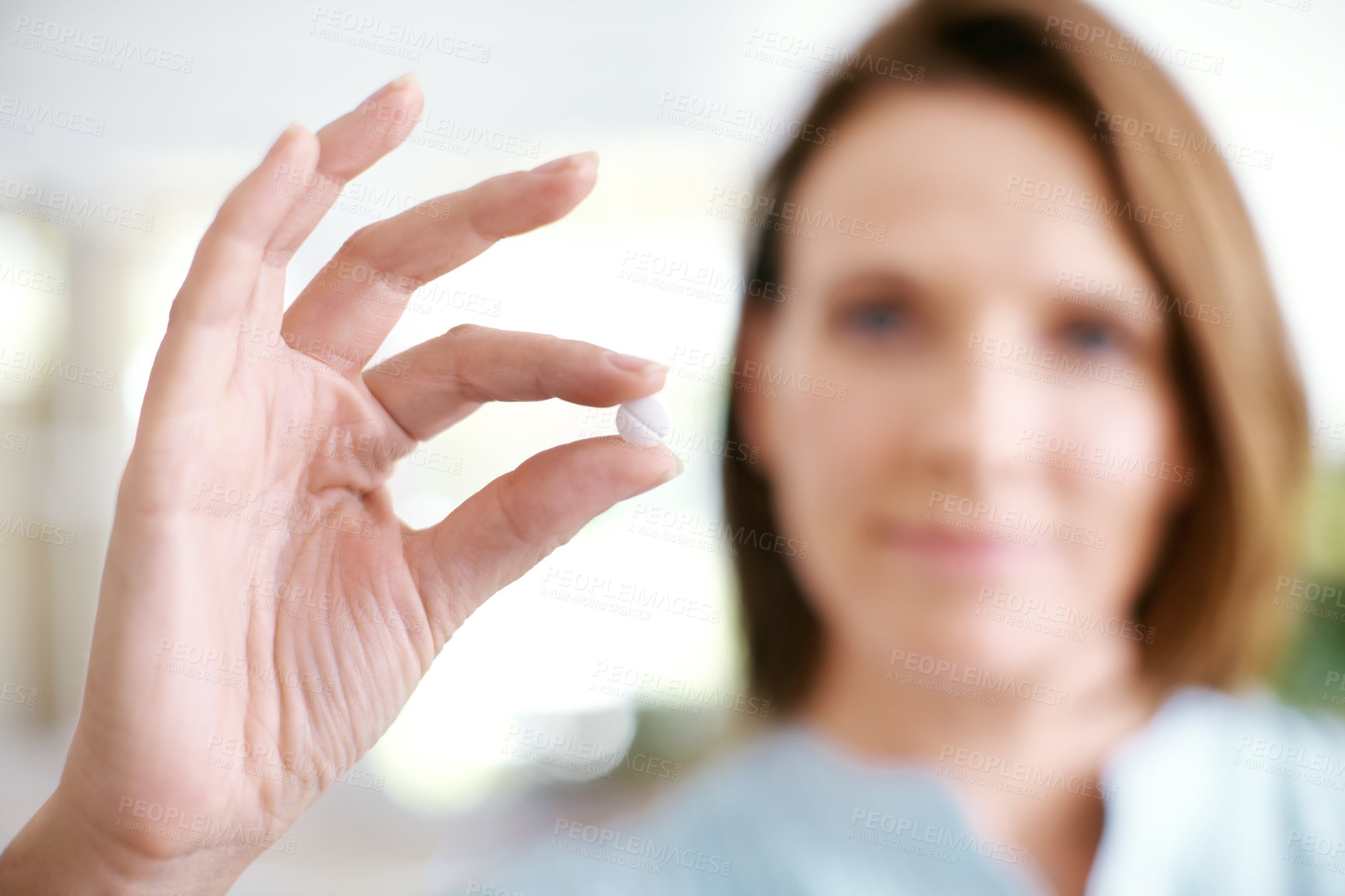 Buy stock photo Hands, tablet and woman with medicine closeup in home for healthcare, wellness or diet supplement for nutrition benefits. Palm, pill or person with drugs for vitamin c or medical probiotics treatment