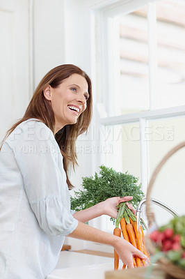 Buy stock photo Excited, woman and healthy food in kitchen with harvest, washing carrots in sink with vegetable basket. Female person, gardener and nutrition for diet, eco friendly and sustainability in agriculture