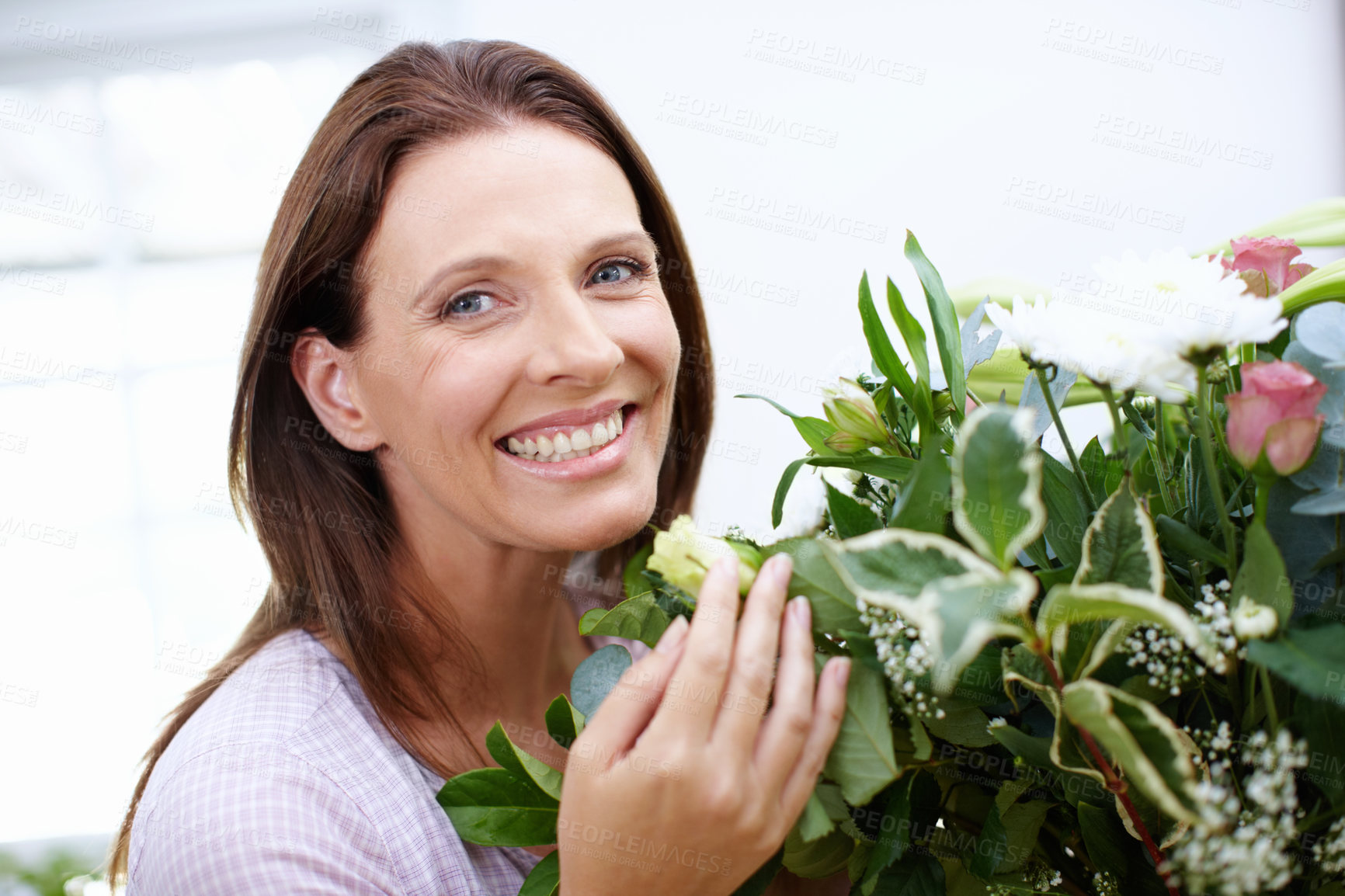 Buy stock photo Smile, portrait and woman with flowers for present, bouquet and happiness with anniversary gift. Floral, plants and mature lady with decoration, fragrance and arrangement at home or house with smell