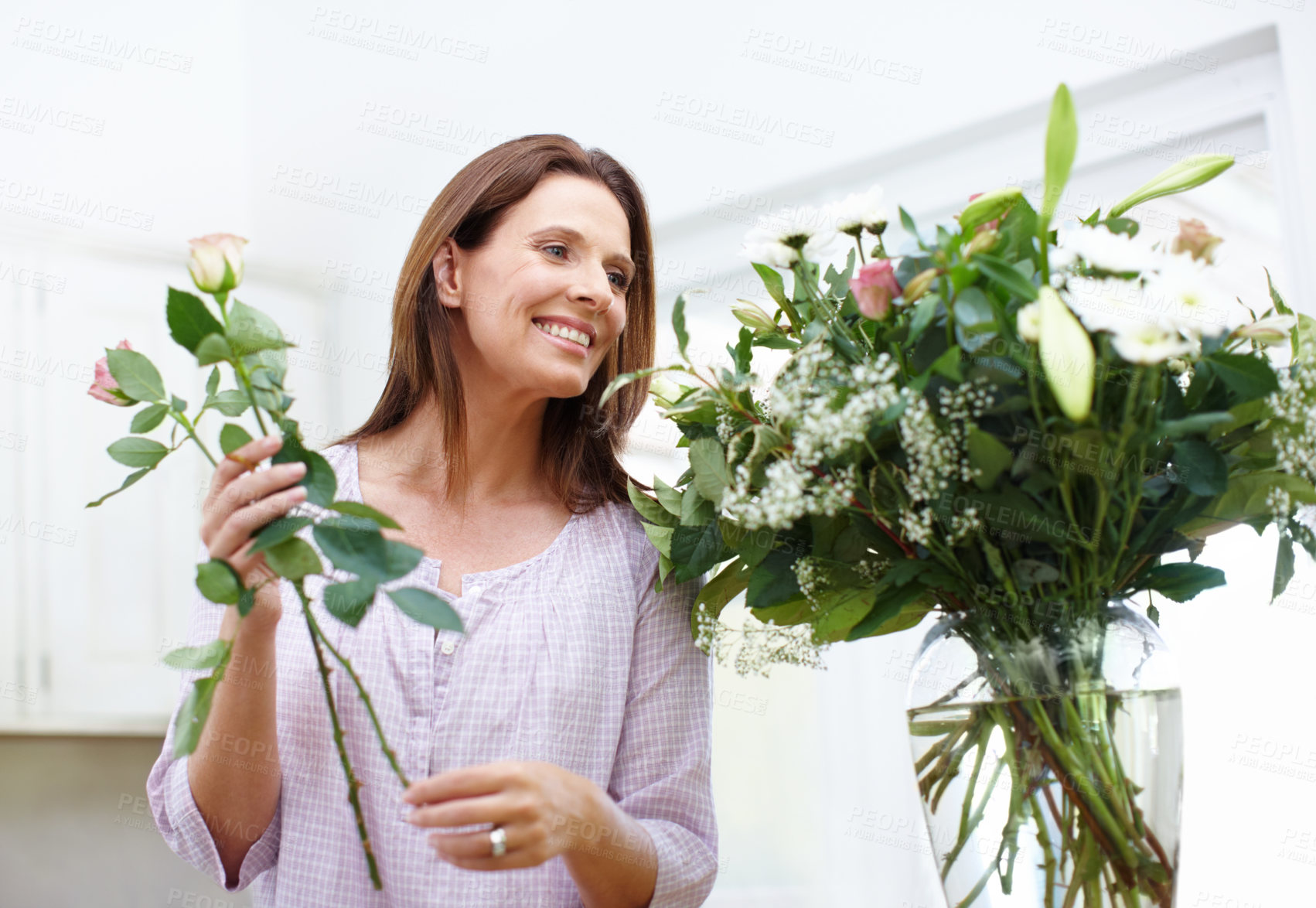 Buy stock photo Bouquet, smell and woman with flowers in vase for present, smile and growth with gift or gardening. Floral, entrepreneurship and florist with plants, nature and arrangement at small business work