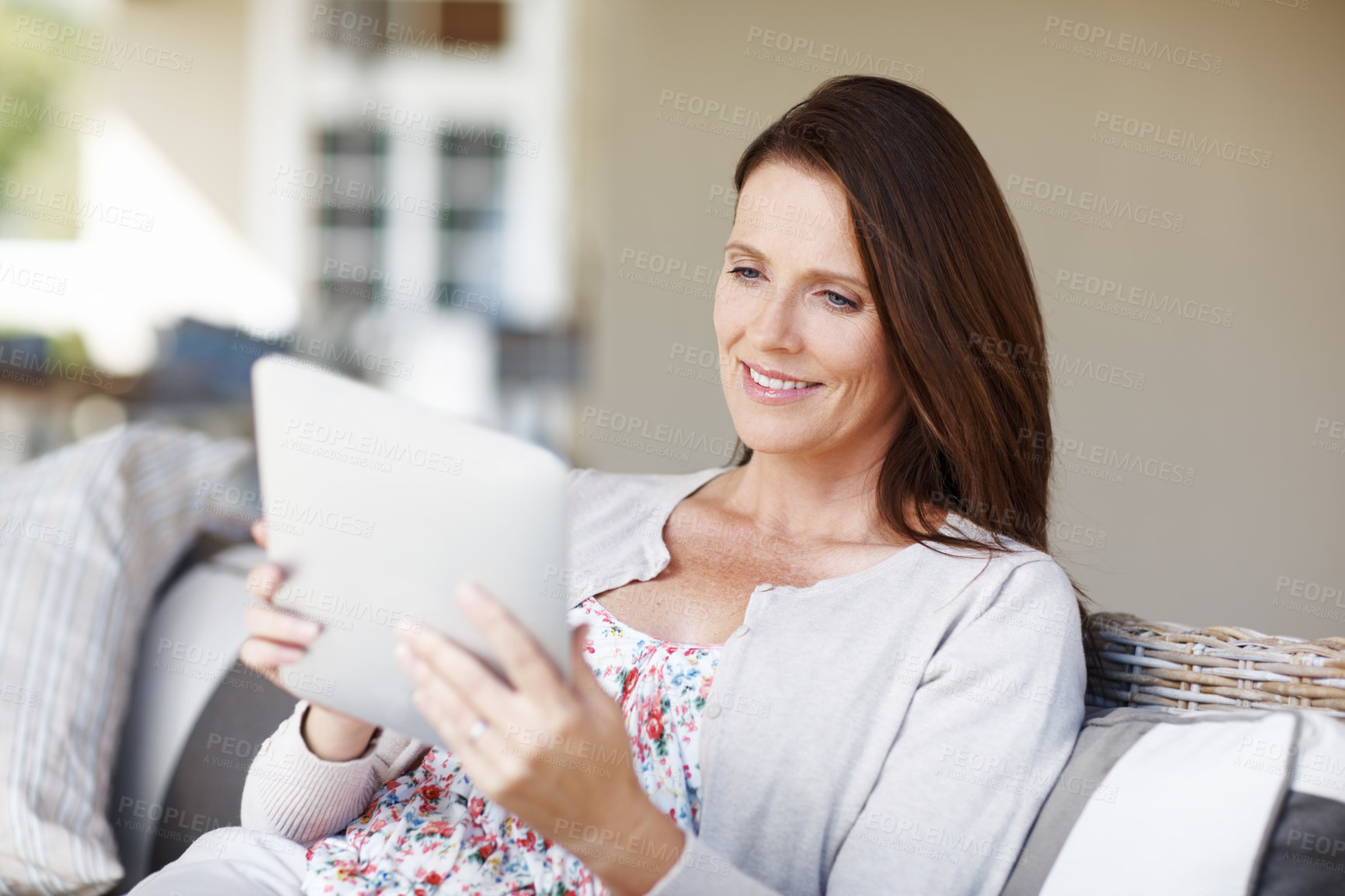 Buy stock photo Tablet, relax and happy woman in home for social media, news or reading ebook in living room. Digital technology, sofa or person scroll on website for online communication, blog or check email on app