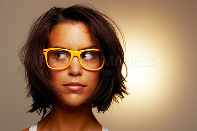 Buy stock photo Thinking, glasses and woman with ideas, fashion and confident girl isolated on a brown studio background. Person, girl and model with funky eyewear, clear vision and daydreaming with mockup space
