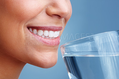 Buy stock photo Detail view of a young pretty female drinking a glass of water