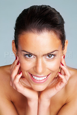 Buy stock photo Closeup of a topless woman with hands on chin against colored background