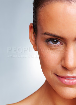 Buy stock photo Macro view of a pretty young girl smiling against colored background
