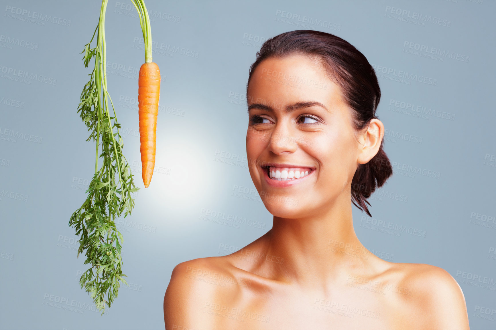 Buy stock photo Woman, happy and skincare with carrot in studio background and satisfied with vegetables. Natural, beauty and smile with confidence on recipe for skin treatment, ingredient and glow with self care