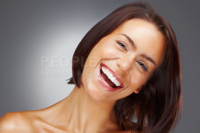 Buy stock photo Closeup portrait of a naked young woman laughing against colored background