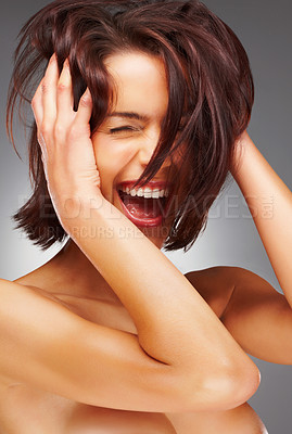 Buy stock photo Closeup portrait of a joyful nude woman laughing against colored background
