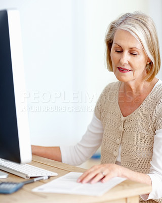 Buy stock photo Mature woman at desk with computer, paperwork and administration for business accounting. Report, review and senior businesswoman reading invoice documents for finance, budget and office management