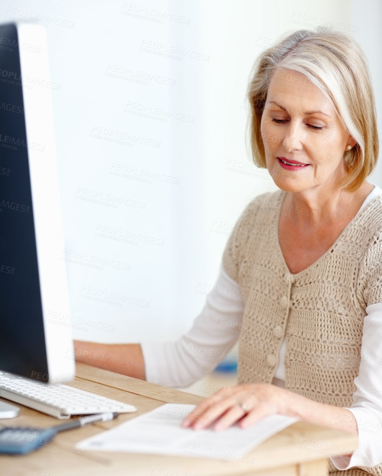 Buy stock photo Mature woman at desk with computer, paperwork and administration for business accounting. Report, review and senior businesswoman reading invoice documents for finance, budget and office management