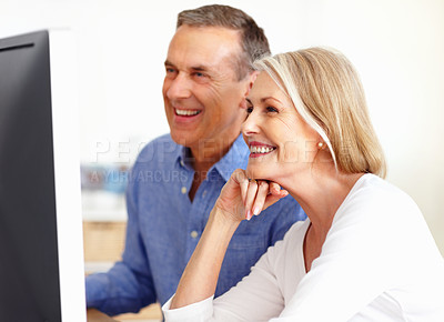 Buy stock photo Search, senior or happy couple on computer for email, social media or streaming subscription in home. Smile, booking holiday vacation online or mature people on a website or internet in living room